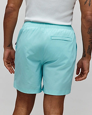 Mens Samos Hydrochromic Printed Swim Trunk in aqua, featuring a relaxed fit, smooth quick-dry fabric, elastic waistband, and a back welt pocket, with a hidden hydrochromic print that appears when wet.