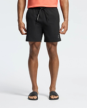 Mens Samos Hydrochromic Printed Swim Trunk in black, featuring a classic fit, smooth quick-dry fabric, a drawstring with white Psycho Bunny text, and a subtle white bunny skull logo on the lower left leg.
