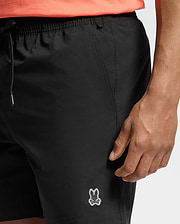 Mens Samos Hydrochromic Printed Swim Trunk, black, smooth quick-dry fabric, drawstring waist with silver tips, side pockets, small light grey rubberized Psycho Bunny skull logo on lower left leg, relaxed fit.