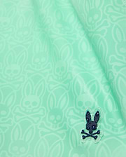 Mens Samos Hydrochromic Printed Swim Trunk 6 in mint green, featuring a subtle all-over hydrochromic Psycho Bunny skull pattern and a small dark blue rubberized bunny skull emblem. (7)