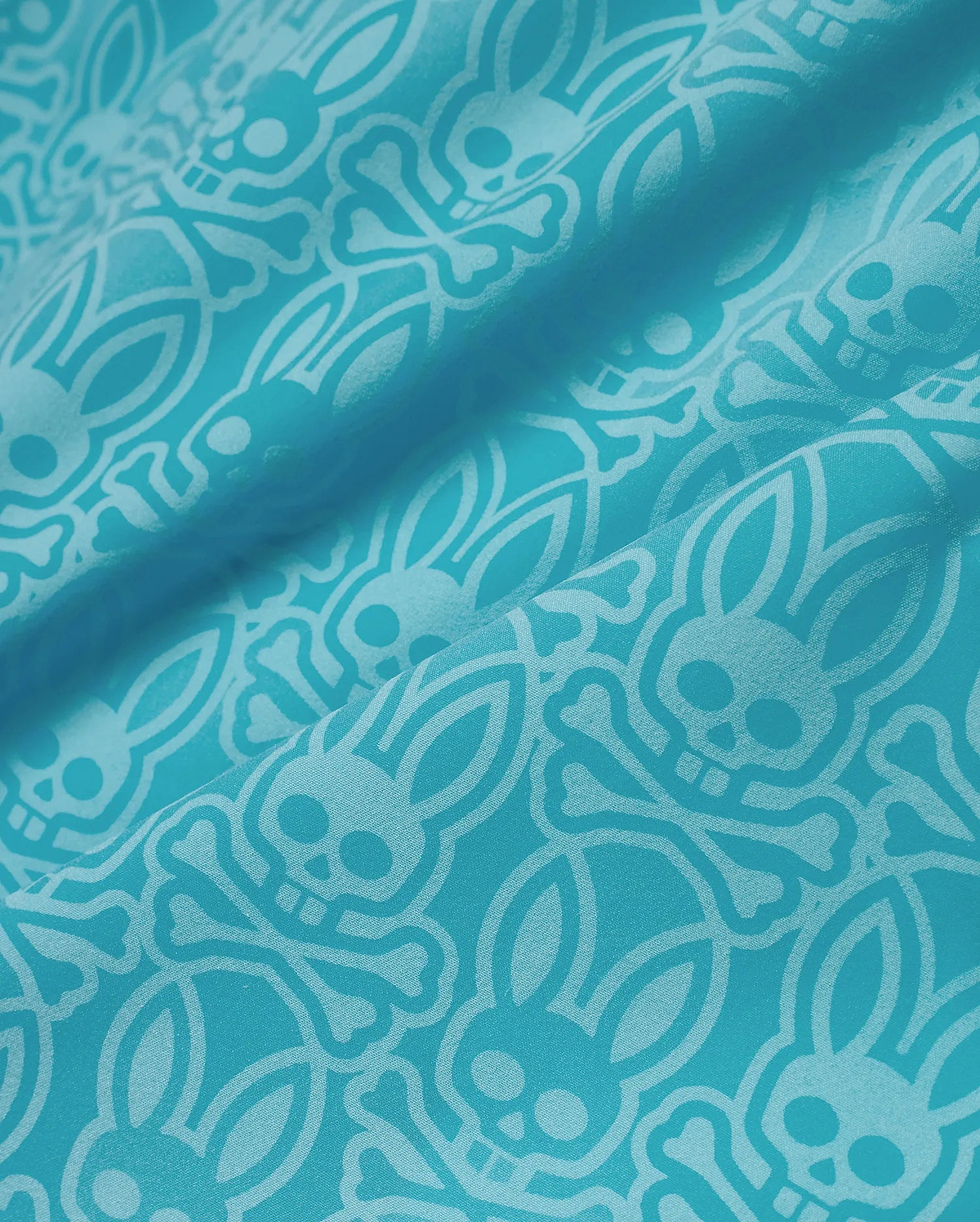 Mens Samos Hydrochromic Swim Trunks in vibrant teal, featuring a tone-on-tone all-over pattern of the iconic Psycho Bunny skull and crossbones logo on a smooth, durable swim fabric. (7)