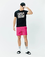 Black classic fit jersey t-shirt with large colorful Psycho Bunny skull graphic, bright pink Mens Samos Hydrochromic Printed Swim Trunk 6 with small embroidered logo, and black cap with pink embroidered Psycho Bunny logo. (6)