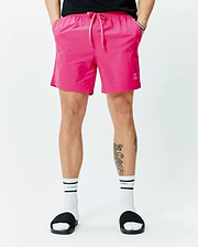 Mens Samos Hydrochromic Printed Swim Trunk 6, vibrant pink, with elastic drawstring waist, side pockets, small embroidered bunny skull logo, and Psycho Bunny tag. Relaxed fit, smooth quick-dry fabric. (3)