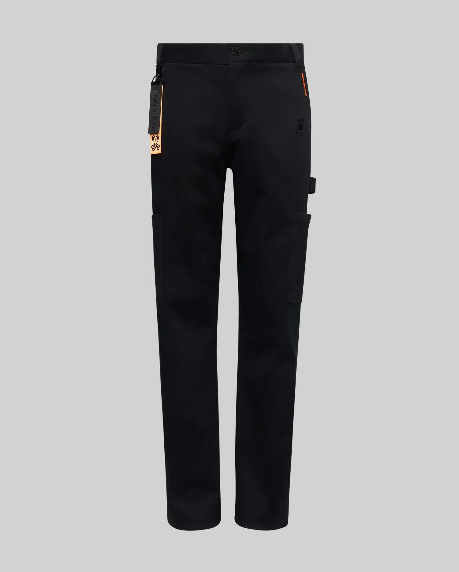 The Psycho Bunny KIDS RUSSELL CARPENTER PANT (KB0600001) in black features a regular fit, straight legs, side and cargo pockets, a right-leg utility loop, and a keychain tag on the front left belt loop, shown on a plain gray background.