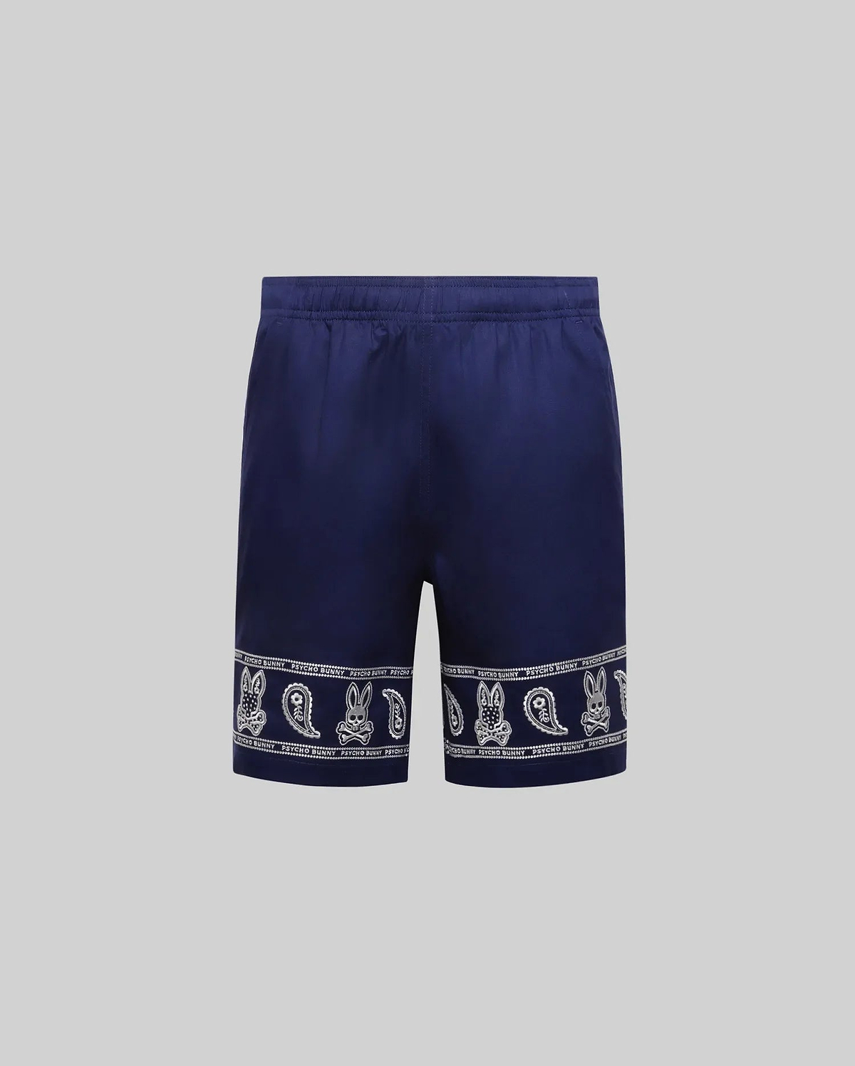 Kids Luke Tencel Short in navy blue with a white bandana-style print featuring repeated Psycho Bunny skull logos and paisley patterns along the hem.