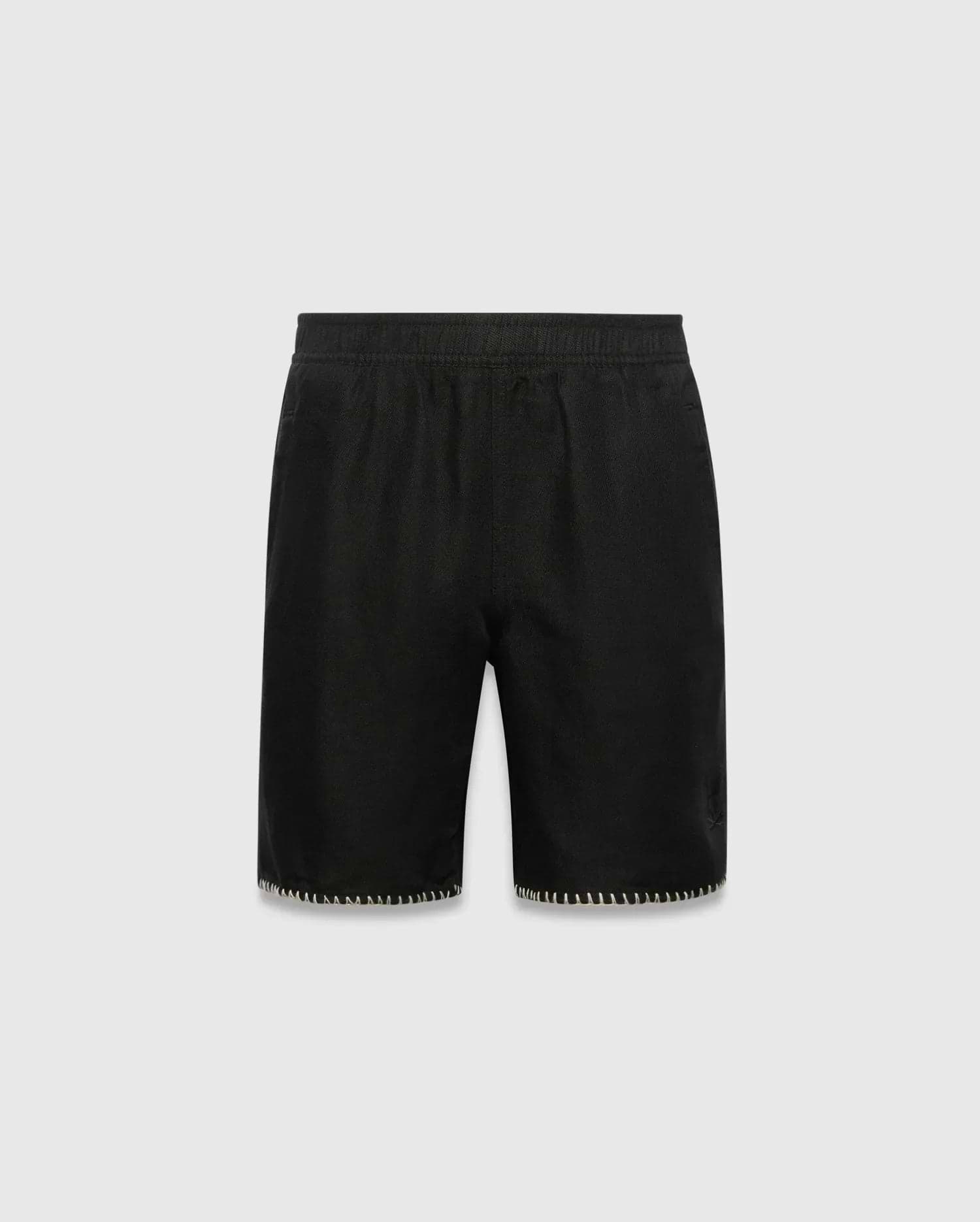 Kids Brad Linen Short, black relaxed fit with linen texture, featuring a subtle tonal embroidered Psycho Bunny skull logo on the lower right leg and white contrast blanket stitching on the hem.