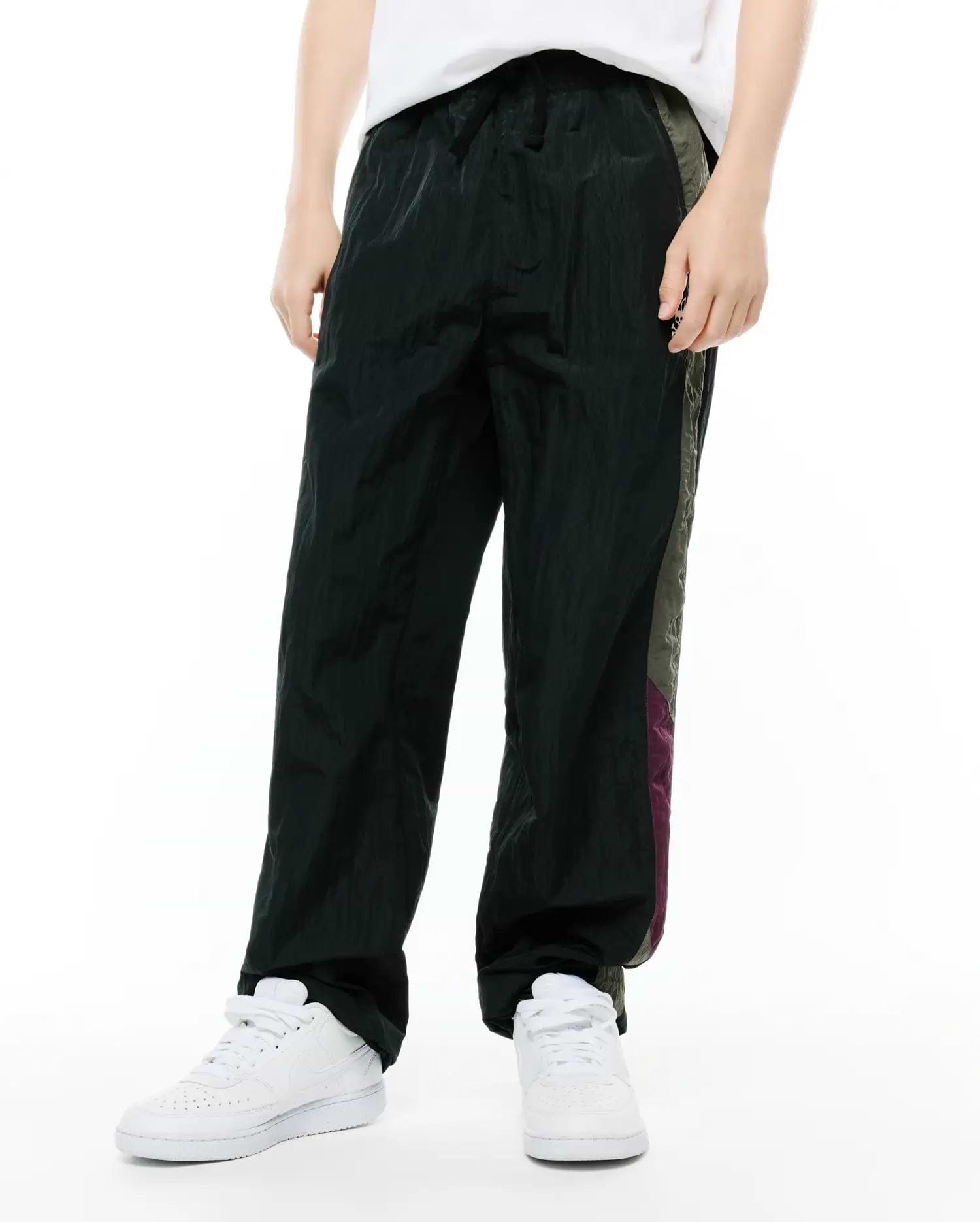 Kids Alder Nylon Colorblock Pant, dark green, featuring a relaxed fit, crinkled nylon texture, and bold side colorblock panels in olive green and purple. (2)