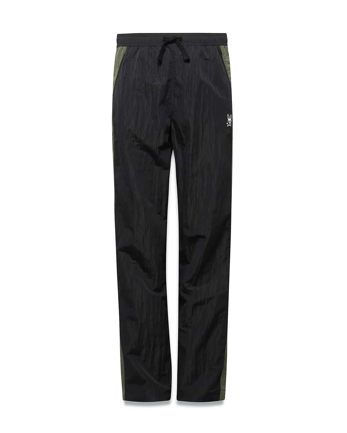 Kids Alder Nylon Colorblock Pant in black crinkled nylon with olive green side panels, featuring a relaxed fit and a small white Psycho Bunny skull logo on the right hip. (5)