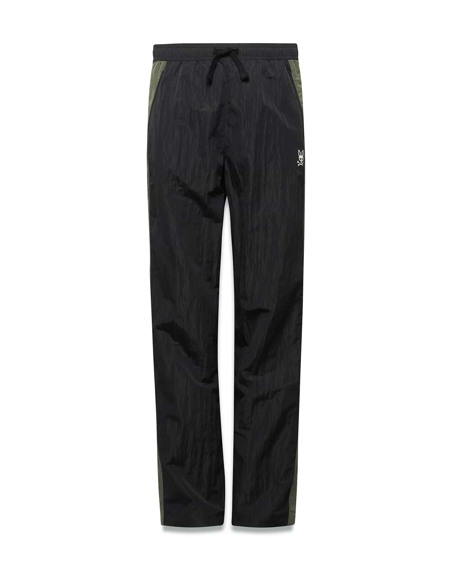 Kids Alder Nylon Colorblock Pant in black crinkled nylon with olive green side panels, featuring a relaxed fit and a small white Psycho Bunny skull logo on the right hip. (5)