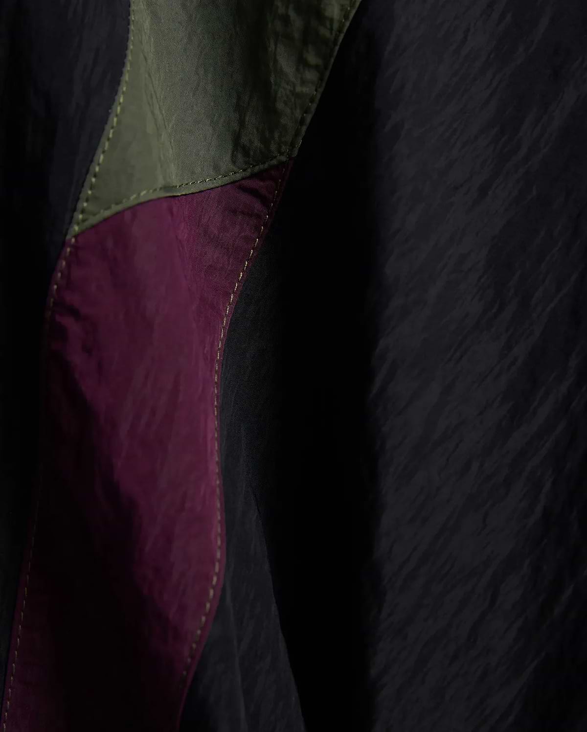 Kids Alder Nylon Colorblock Pant featuring crinkled black nylon with bold olive green and deep magenta colorblock panels, accented by prominent light yellow stitching. (6)