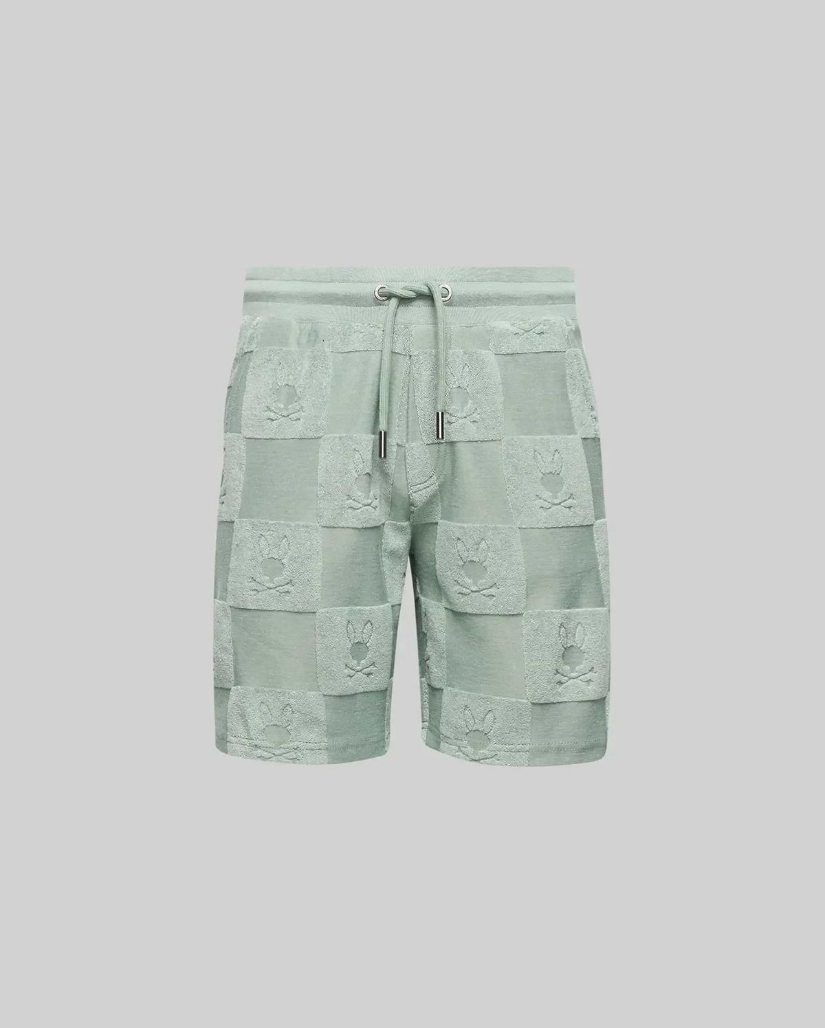 The Psycho Bunny KIDS KELVIN TOWEL TERRY SWEATSHORT (KB0900002) features light green cotton-blend jacquard terry, with a drawstring waist and a checkered pattern of alternating solid/textured squares and playful bunny heads.