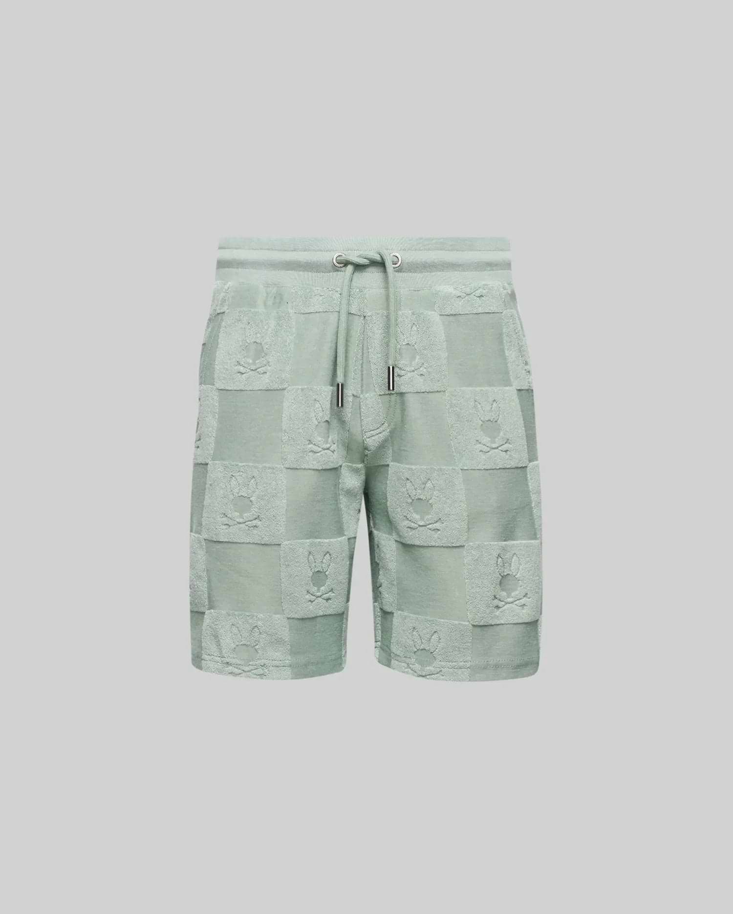 The Psycho Bunny KIDS KELVIN TOWEL TERRY SWEATSHORT (KB0900002) features light green cotton-blend jacquard terry, with a drawstring waist and a checkered pattern of alternating solid/textured squares and playful bunny heads.