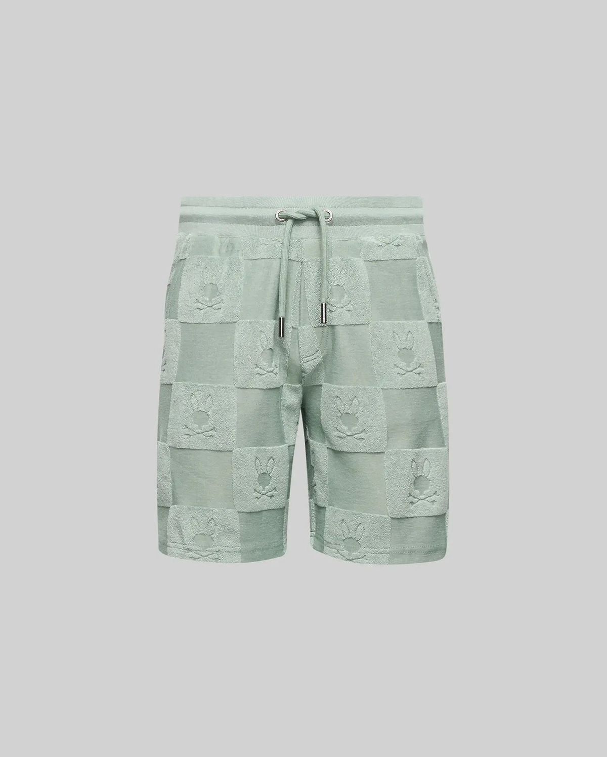 The Psycho Bunny KIDS KELVIN TOWEL TERRY SWEATSHORT (KB0900002) features light green cotton-blend jacquard terry, with a drawstring waist and a checkered pattern of alternating solid/textured squares and playful bunny heads.