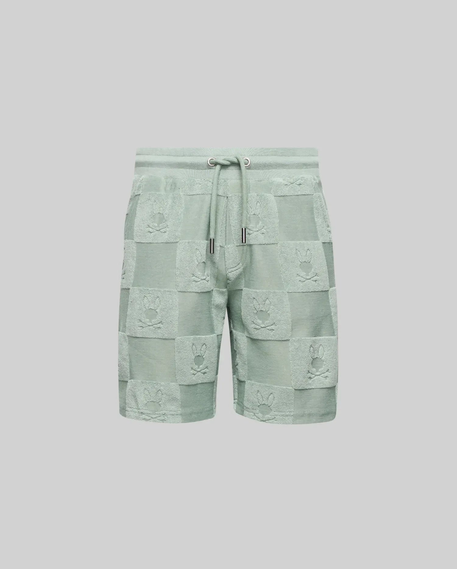 The Psycho Bunny KIDS KELVIN TOWEL TERRY SWEATSHORT (KB0900002) features light green cotton-blend jacquard terry, with a drawstring waist and a checkered pattern of alternating solid/textured squares and playful bunny heads.