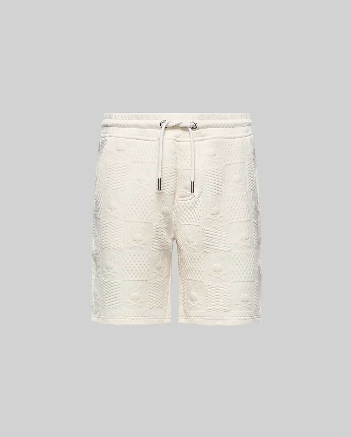 Kids Dustin Sweatshort, cream textured knit with a relaxed fit. Features an all-over embossed checkerboard pattern of Psycho Bunny skull logos and geometric squares.