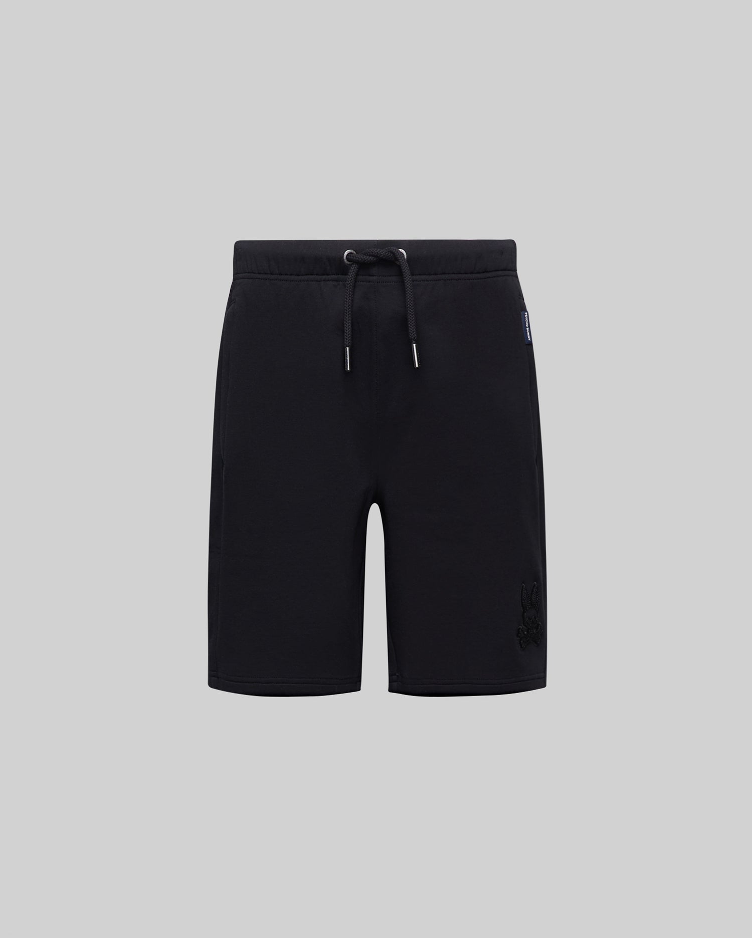 Black Kids Barry Modal Short with a relaxed fit, featuring a drawstring waist, tonal embroidered Psycho Bunny skull logo on the lower right leg, and a blue Psycho Bunny side tag.