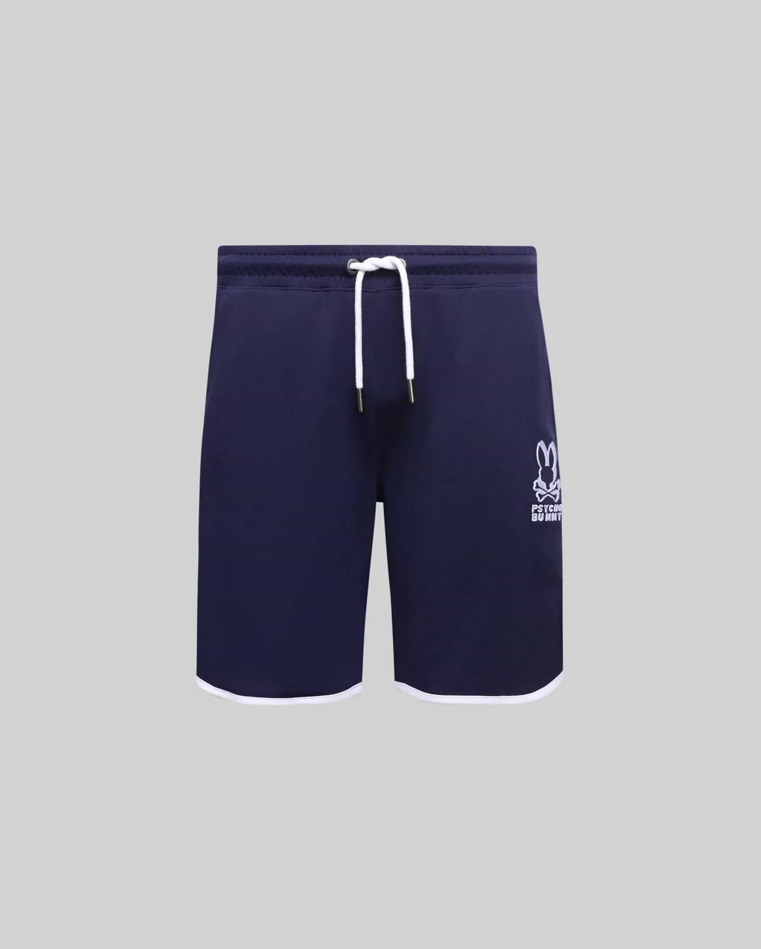 Navy Kids Toby Short, relaxed fit, smooth jersey, featuring white leg opening trim, white drawstrings with gold tips, and a large embroidered Psycho Bunny skull logo on the lower left leg.
