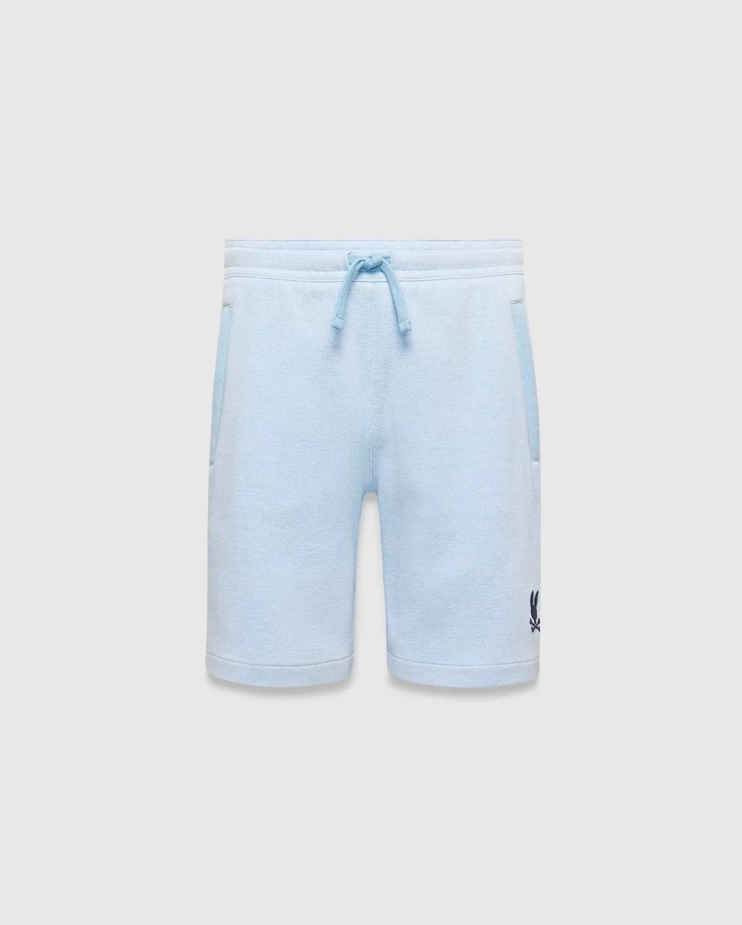 Light blue heathered Kids Keith Short, relaxed fit, soft jersey knit with dark blue drawstring, tonal side pocket trim, and a small embroidered Psycho Bunny skull logo on the left leg. (5)