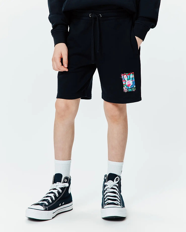 Kids Isaac Print Short, black relaxed fit French terry shorts with a drawstring waist, pockets, and a vibrant abstract multi-color bunny skull graphic print on the left leg.