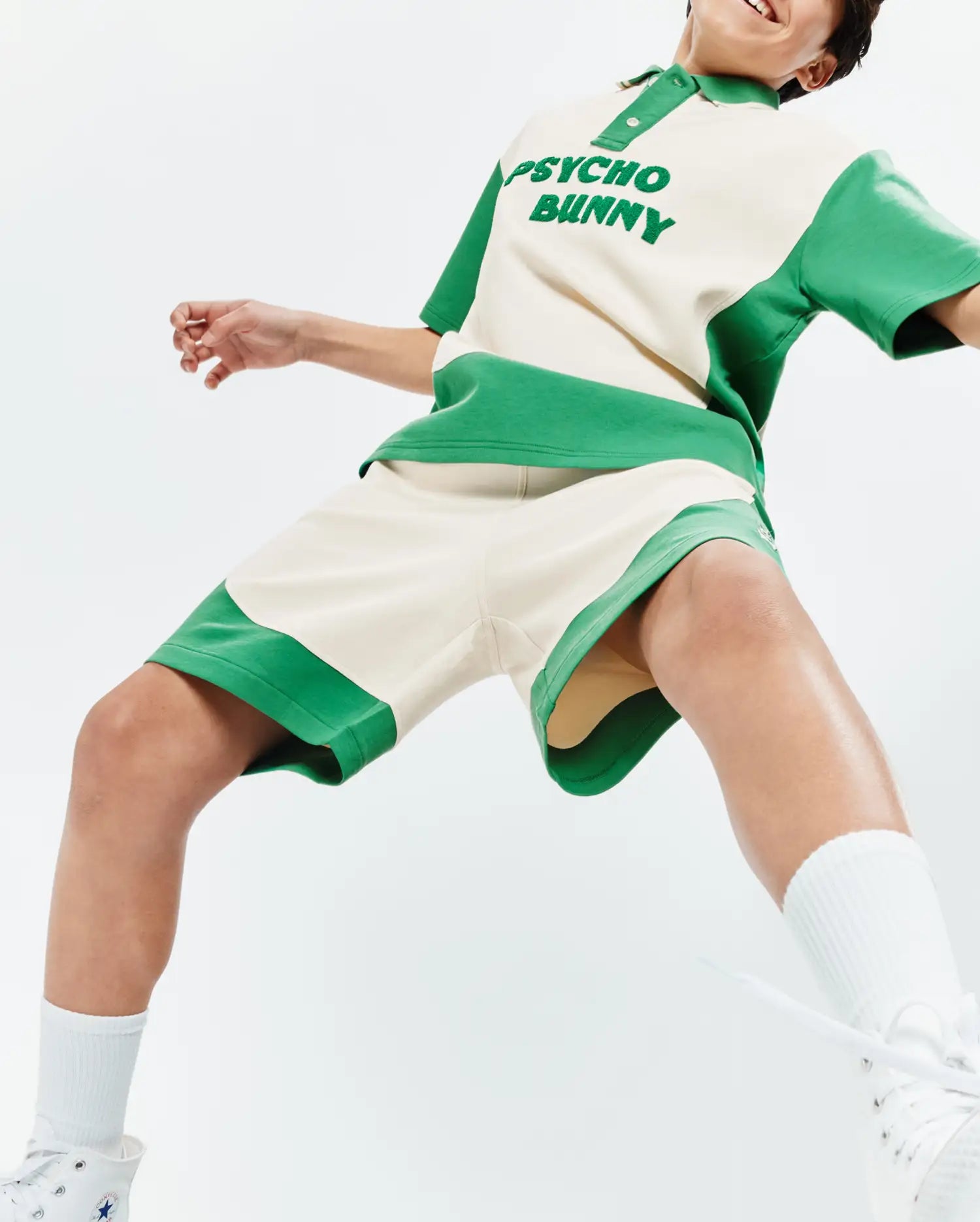 Cream and vibrant green color-blocked Psycho Bunny polo shirt, featuring a large embroidered chest logo, paired with matching relaxed-fit Kids Kelly Short in soft french terry fabric.