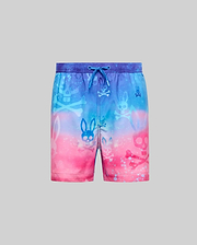 Kids Caspian Swim Trunk featuring a vibrant blue to pink gradient, all-over print of Psycho Bunny skull and crossbones logos, relaxed fit, and a blue drawstring waist.