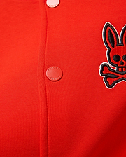 Kids Joey Knit Bomber in vibrant red, featuring a fine ribbed knit texture, an embroidered black and white Psycho Bunny skull logo on the left chest, and red branded snap buttons.