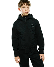 Kids Gordley Mix Media Jacket, black, classic fit, hooded full-zip with quilted front panel, jersey sleeves, ribbed cuffs/hem, and a small embroidered dark grey Psycho Bunny skull logo on the left chest.