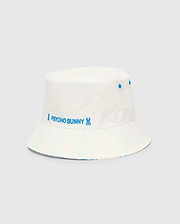 Kids Frank Reversible Bucket Hat in white, featuring a blue embroidered Psycho Bunny text and skull logo on a band, blue eyelets, and a vibrant multicolor pattern visible on the reverse brim.