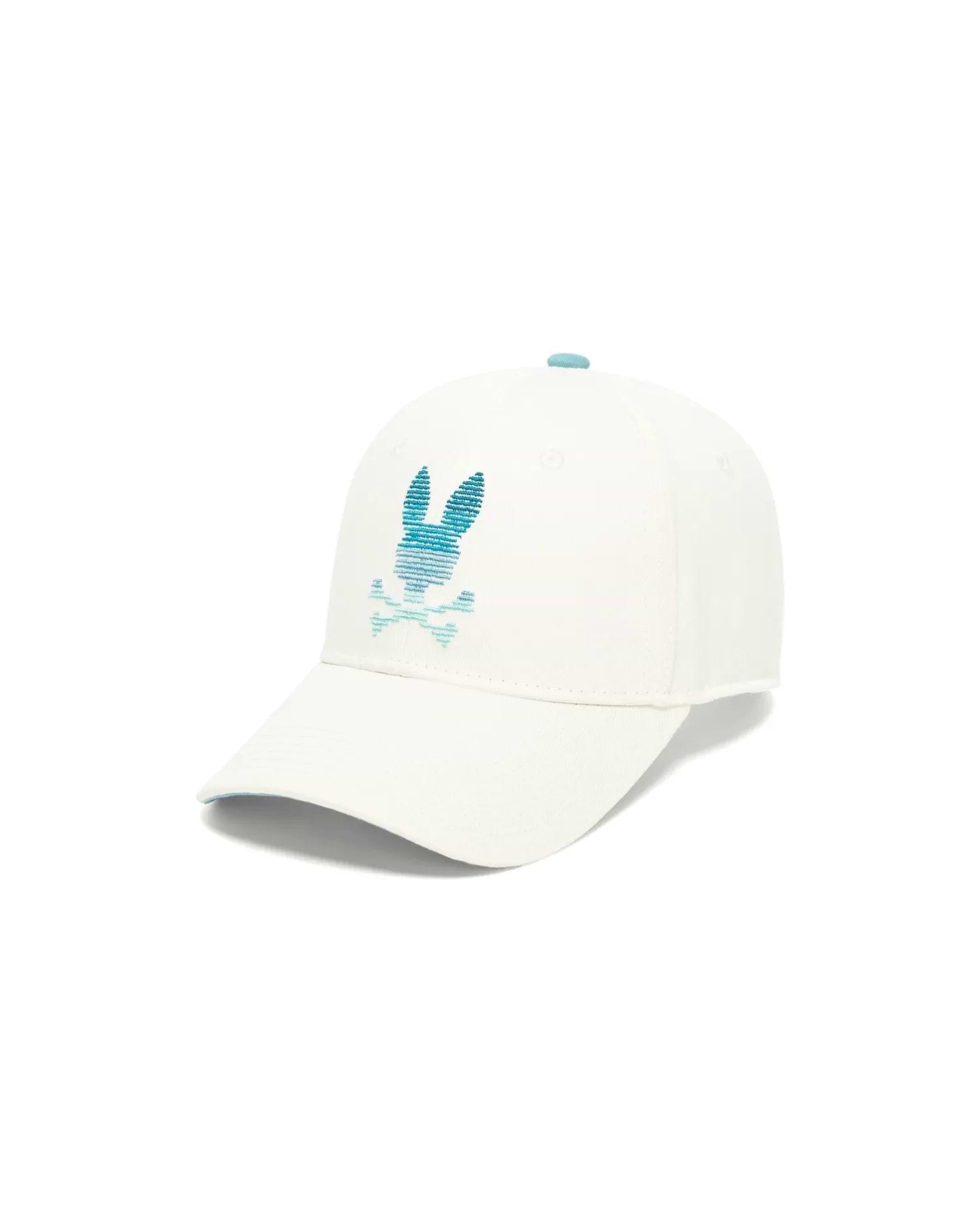 Kids' Slade Baseball Cap in white cotton twill, featuring a large embroidered teal and blue gradient Psycho Bunny skull logo on the front, with a light blue button and under brim. (1)