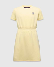 Kids Girl's Penelope Dress in pale yellow jersey, featuring a relaxed fit, crew neck, short sleeves, elasticated waist, and a small embroidered pink and white Psycho Bunny skull logo on the left chest. (5)