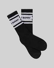 A set of KIDS 3 PACK SPORT SOCK (KO2200001) by Psycho Bunny, black crew socks in soft Pima cotton-blend with white stripes and "BUNNY" in black on the stripes, displayed on a light gray background.
