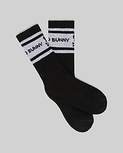 A set of KIDS 3 PACK SPORT SOCK (KO2200001) by Psycho Bunny, black crew socks in soft Pima cotton-blend with white stripes and "BUNNY" in black on the stripes, displayed on a light gray background.