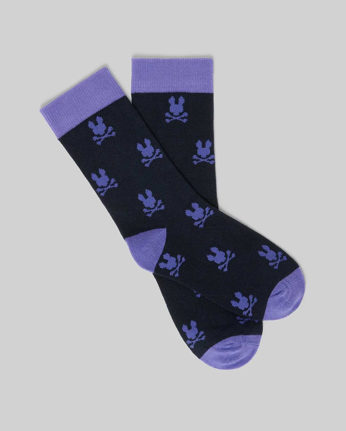 A 2-pack of kids' black crew dress socks by Psycho Bunny, featuring soft Pima cotton and an all-over purple bunny design—perfect for adding playful style to formalwear. (2)