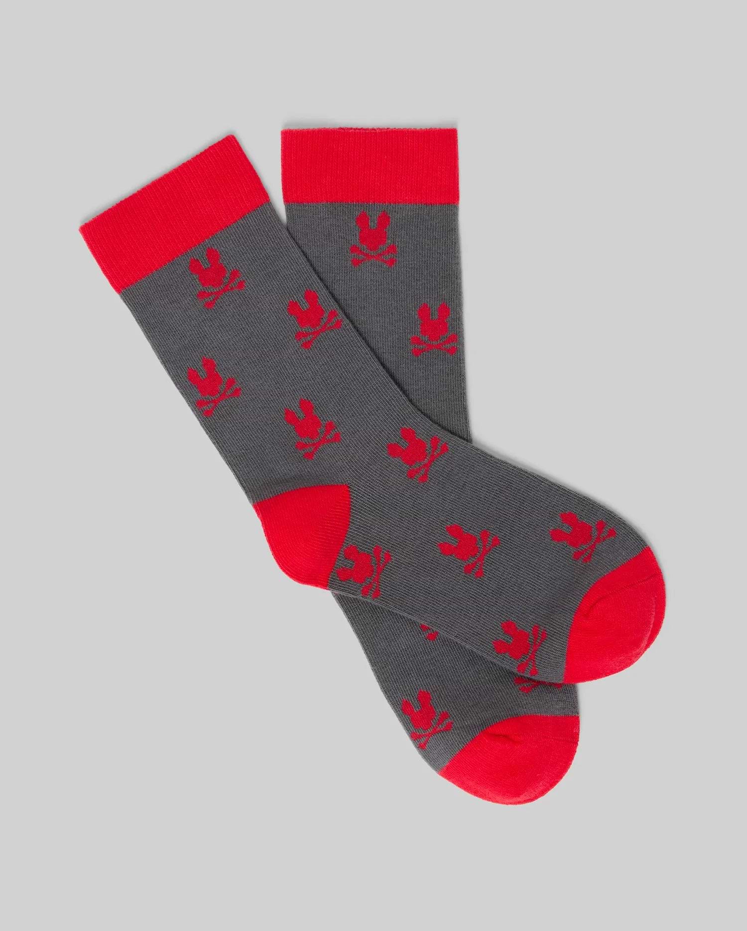 Psycho Bunny KIDS 2 PACK ALL OVER BUNNY DRESS SOCK - KO2200003: Gray Pima cotton socks with red heels, toes, and cuffs, featuring repeated red bunny patterns on a plain gray background. (3)