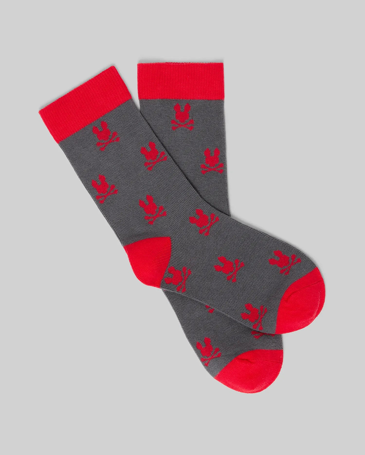 Psycho Bunny KIDS 2 PACK ALL OVER BUNNY DRESS SOCK - KO2200003: Gray Pima cotton socks with red heels, toes, and cuffs, featuring repeated red bunny patterns on a plain gray background. (3)