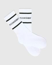 White Kids 3 Pack Sport Socks featuring a smooth knit fabric, accented with two black stripes around the cuff and prominent black Psycho Bunny text branding on the side for athletic wear.