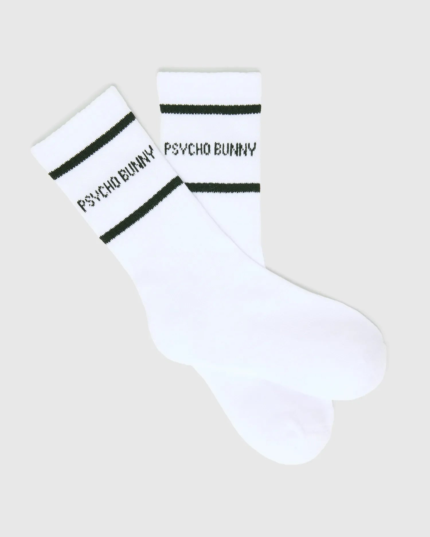 White Kids 3 Pack Sport Socks featuring a smooth knit fabric, accented with two black stripes around the cuff and prominent black Psycho Bunny text branding on the side for athletic wear.