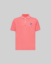 Kids Ara Pique Polo in coral pink, featuring a classic fit, pique knit fabric, white two-button placket, ribbed collar and cuffs with white tipping, and a small embroidered multi-color Psycho Bunny skull logo on the left chest.
