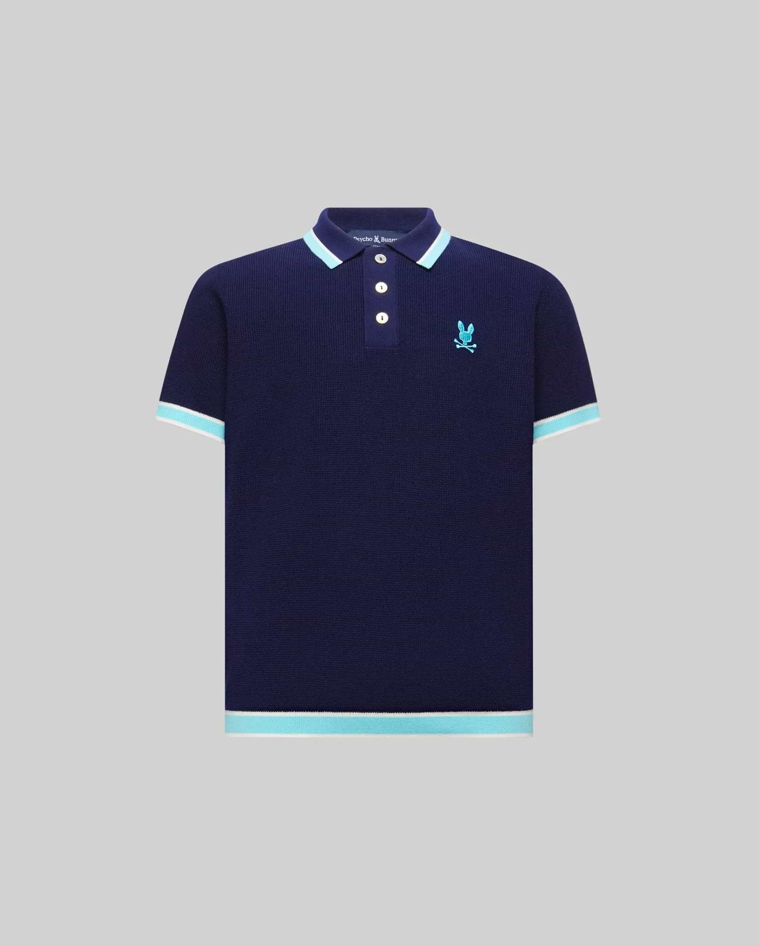 Kids Dax Knit Polo in navy, featuring a classic fit, knit texture, and a small embroidered light blue Psycho Bunny skull logo on the left chest. It has light blue and white striped collar, cuffs, and hem.