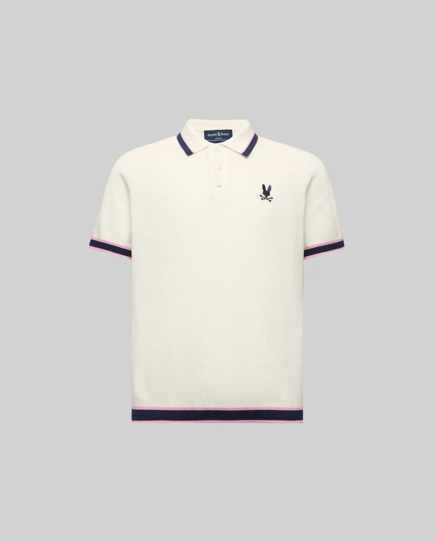 Kids Dax Knit Polo in cream, featuring a classic fit, fine knit texture, navy and pink striped collar, cuffs, and hem, with a small embroidered navy Psycho Bunny logo on the left chest.