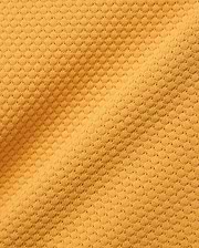 Kids Devon Knit Polo in bold golden-yellow, crafted from a premium, refined knit fabric featuring a distinctive micro-waffle texture, perfect for elevated streetwear style.