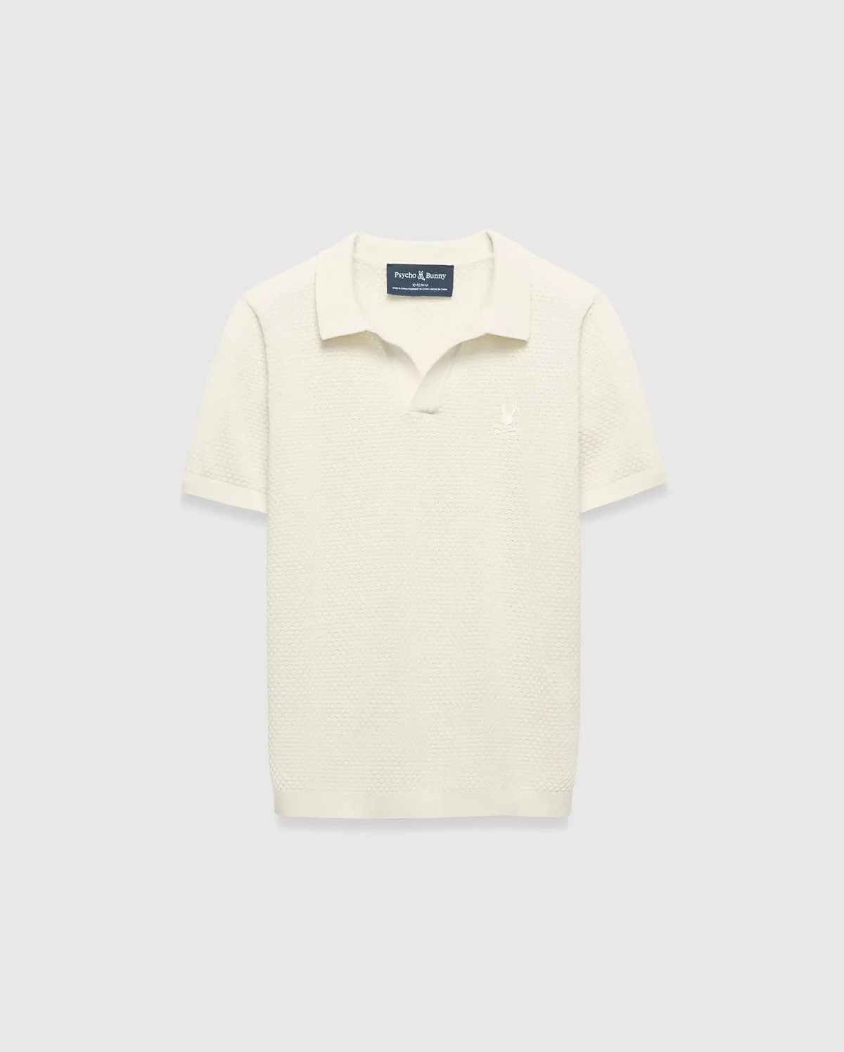 Kids Devon Knit Polo in cream, featuring a textured knit fabric, classic fit, and a small tonal embroidered Psycho Bunny skull logo on the left chest.