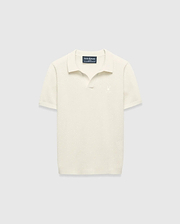 Kids Devon Knit Polo in cream, featuring a textured knit fabric, classic fit, and a small tonal embroidered Psycho Bunny skull logo on the left chest.