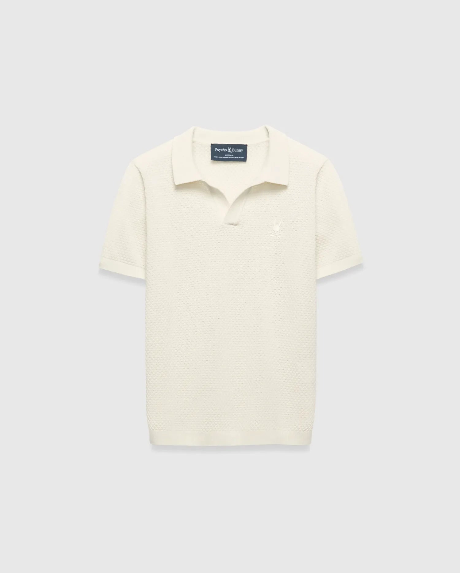 Kids Devon Knit Polo in cream, featuring a textured knit fabric, classic fit, and a small tonal embroidered Psycho Bunny skull logo on the left chest.