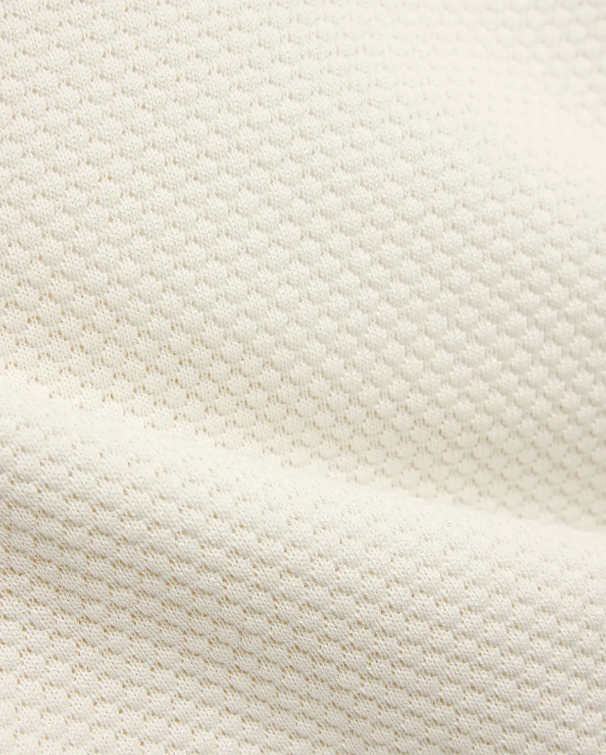 Kids Devon Knit Polo in creamy off-white, featuring a refined textured knit fabric with a subtle, breathable pique-like pattern, perfect for premium streetwear.