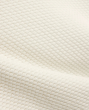 Kids Devon Knit Polo in creamy off-white, featuring a refined textured knit fabric with a subtle, breathable pique-like pattern, perfect for premium streetwear.