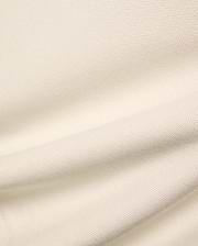 Kids Holden Pique Polo in a soft cream hue, crafted from textured pique fabric, featuring the iconic embroidered Psycho Bunny skull logo on the left chest.