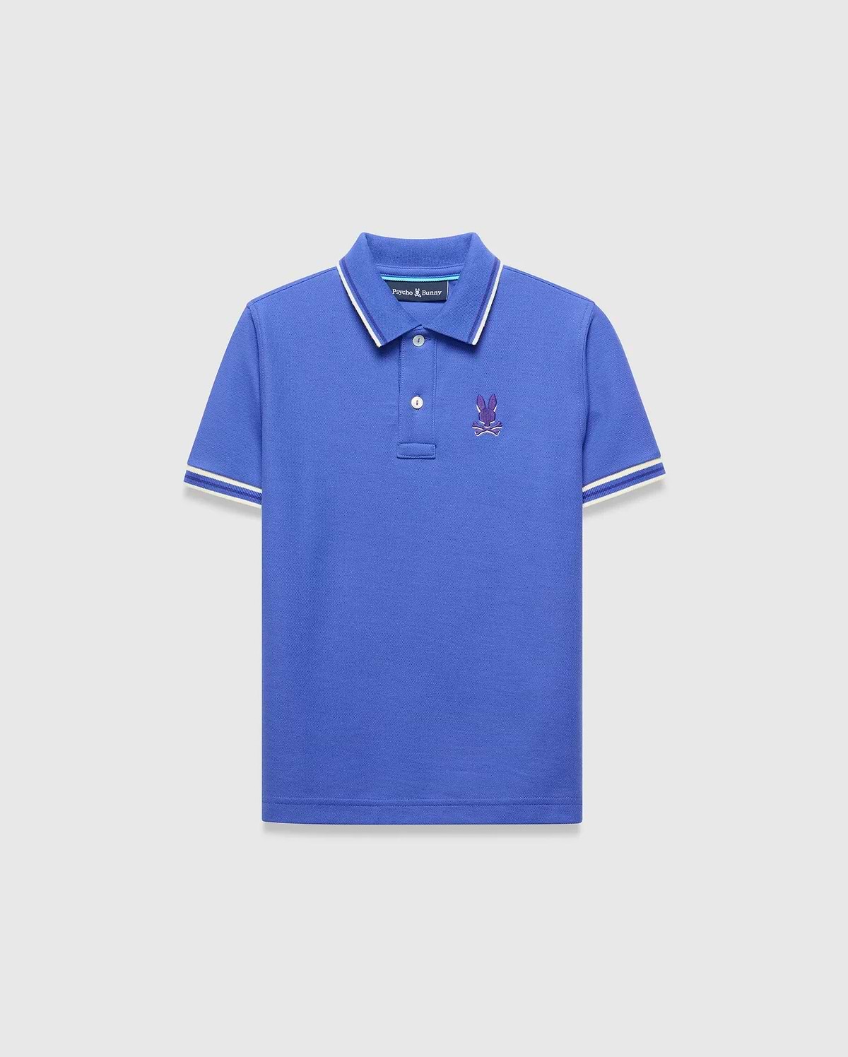 Kids Brad Pique Polo, royal blue classic fit pique polo with white tipped collar and cuffs, featuring a small embroidered purple Psycho Bunny skull logo on the left chest.