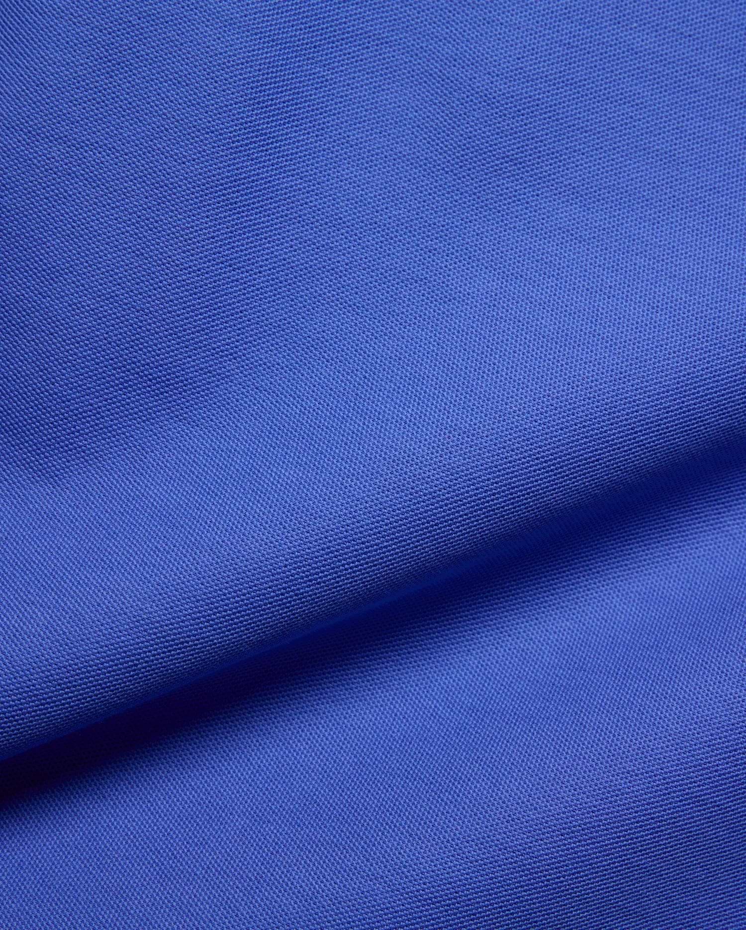 Kids Brad Pique Polo, a vibrant royal blue premium pique fabric, showcasing its distinctive textured weave, embodying Psycho Bunny's bold, refined streetwear aesthetic for a classic fit.
