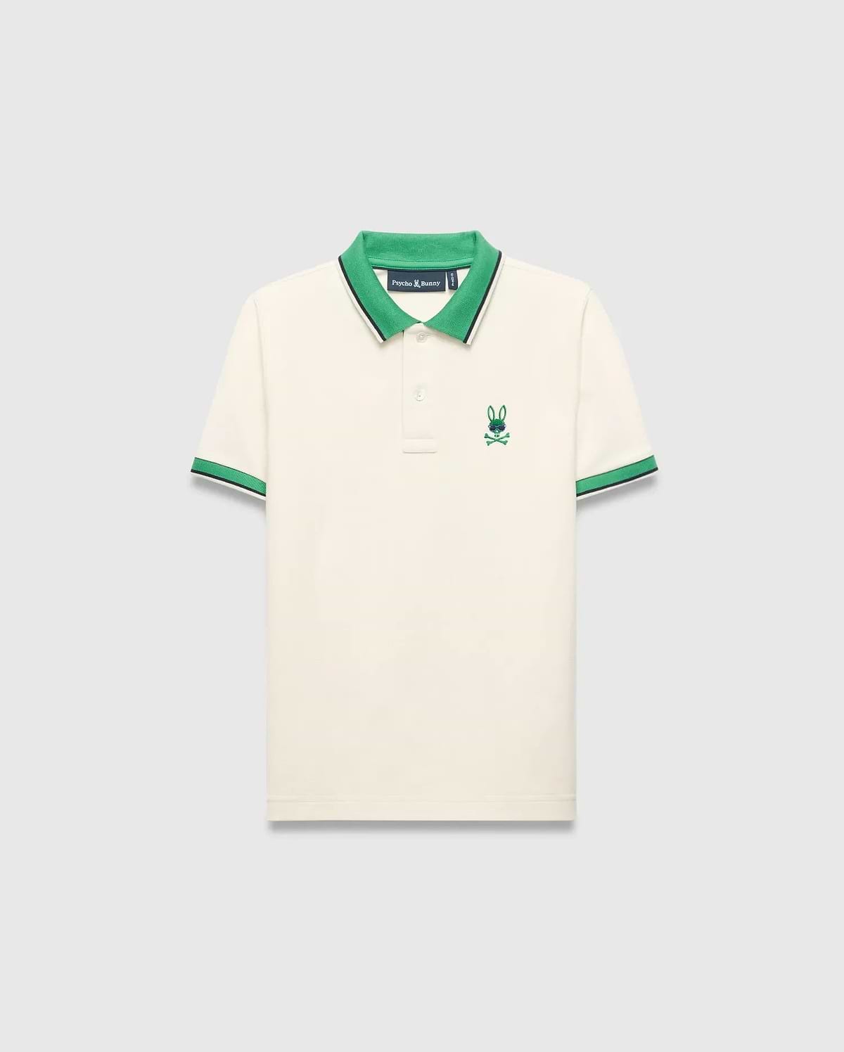 Kids Sunny Pique Polo in cream pique, classic fit, with a vibrant green collar, green and navy striped cuffs, and an embroidered green and blue Psycho Bunny skull logo on the left chest. (5)